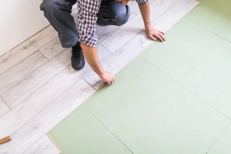 LVT bonded flooring being installed with adhesive – Flooring Installation Services London