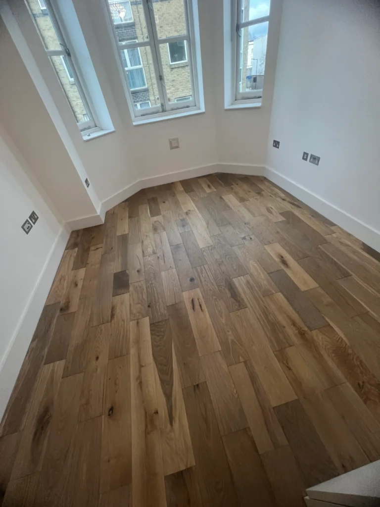 Oak plank flooring installation in London home