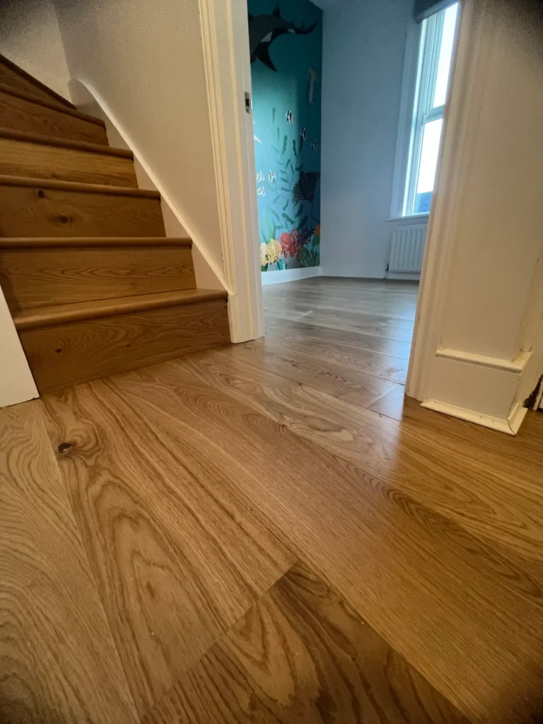 Wooden staircase and flooring installation in Camden home