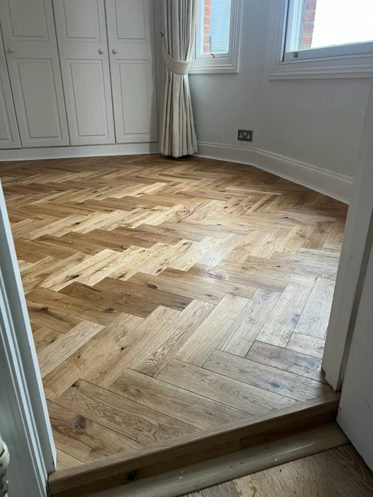 Light wood herringbone flooring for modern interiors