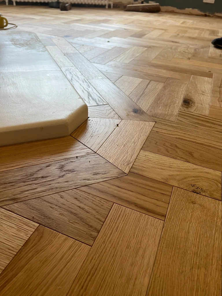 Precision herringbone floor fitting by ROI Flooring experts