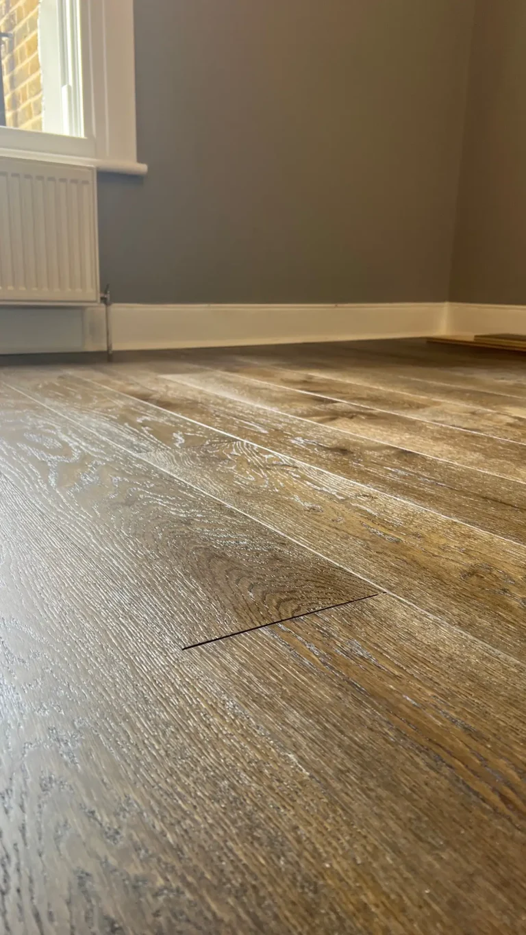 Close-up of oak wood flooring installation in a London flat