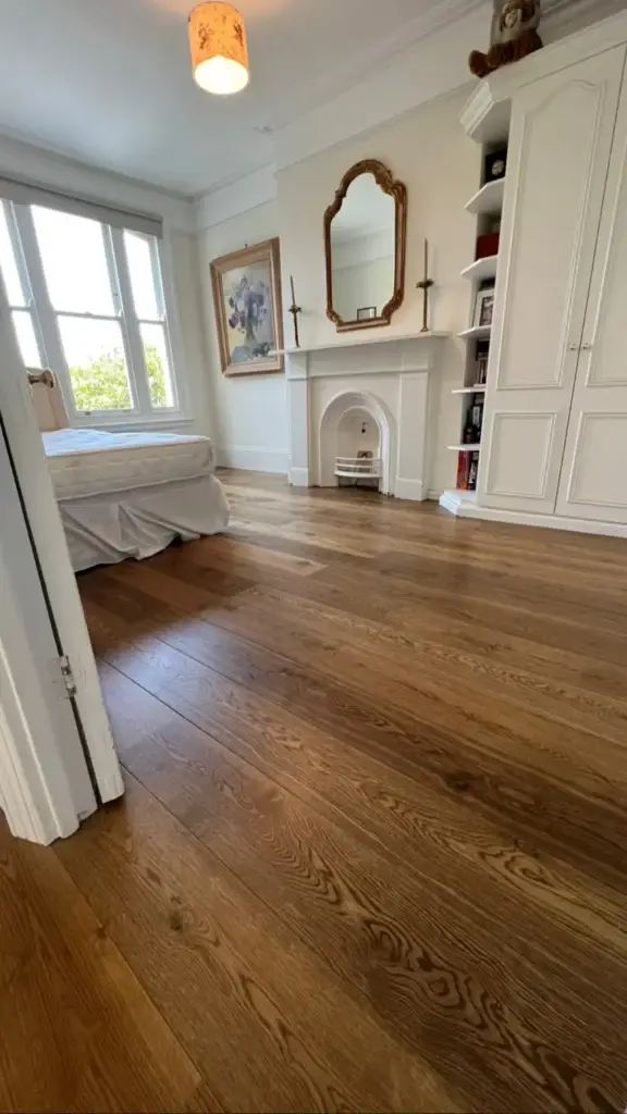 Engineered oak flooring fitted in traditional bedroom interior